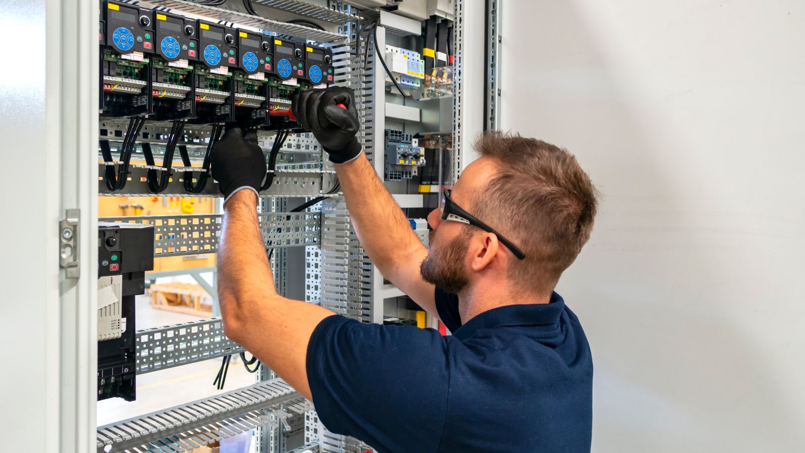 a technician performing Professional Electrical Services