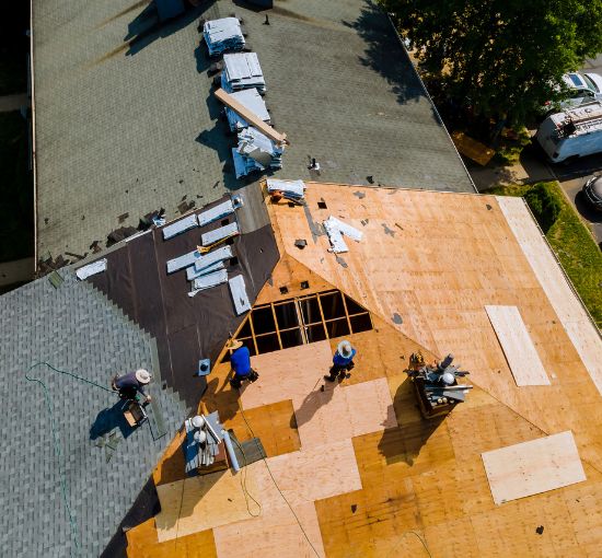 Professional roofing services in Birmingham, Alabama – expert roofers working on a full roof replacement for durability and protection.