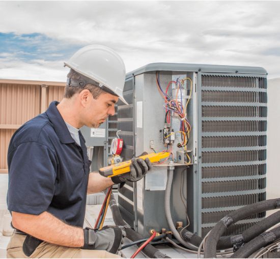 Expert HVAC technician servicing an outdoor air conditioning unit for optimal performance.